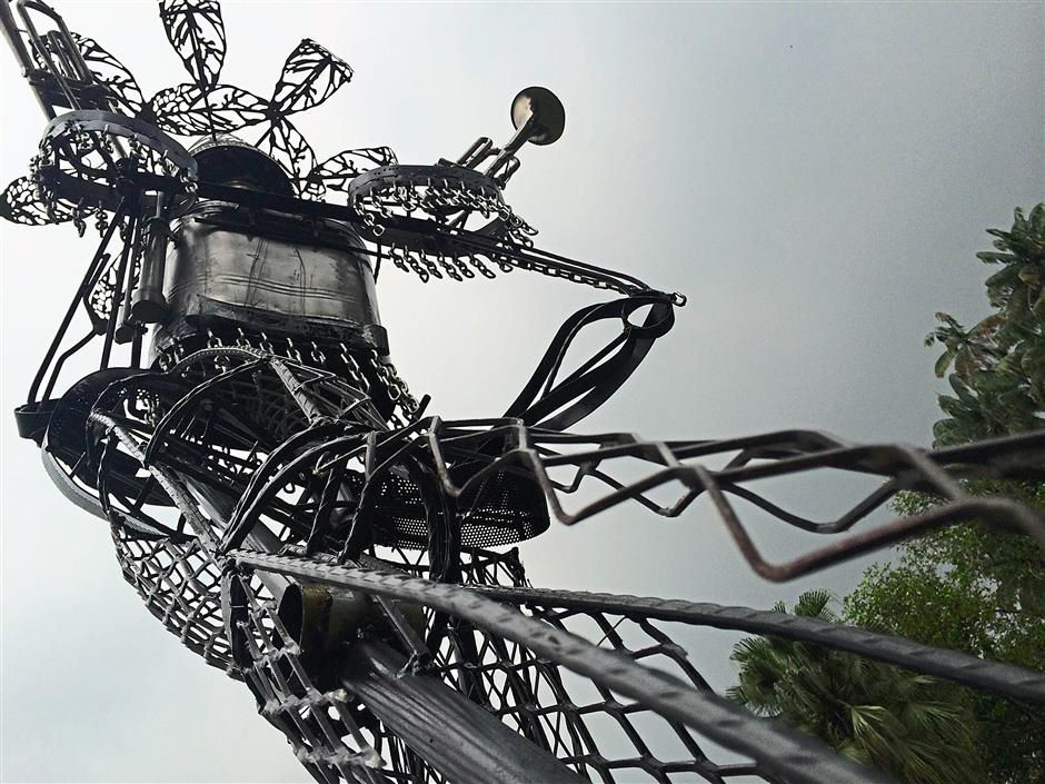 Artists Izan Tahir and Marvin Chan collaborated on The Boulevard Sentinel, inspired by the Chinese gods on temple doors. They constructed the modern guardian from mild steel rods and recycled materials like trumpets found at an old Chinese school in KL. (Source: Star Online)