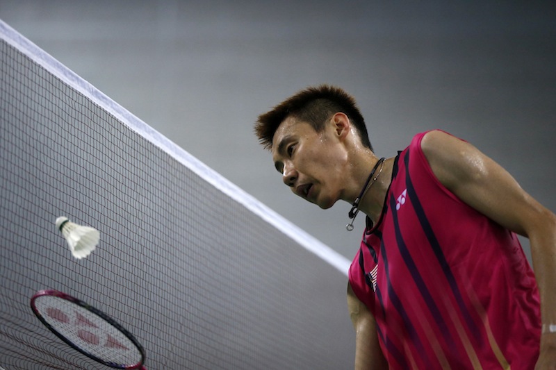 Malaysia's Lee Chong Wei is pictured at the net during his men's singles semi-final badminton match against China's Lin Dan at Gyeyang Gymnasium at the 17th Asian Games in Incheon