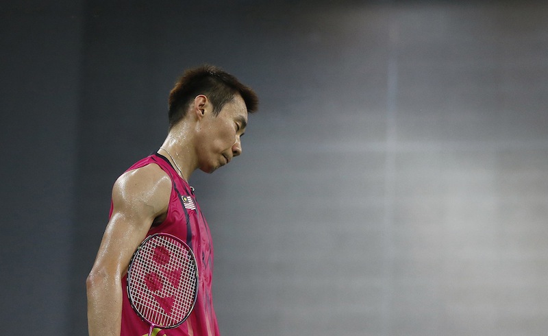 Malaysia's Lee Chong Wei reacts after losing a point against Vietnam during the men's singles quarter final badminton match at Gyeyang Gymnasium, at the 17th Asian Games in Incheon