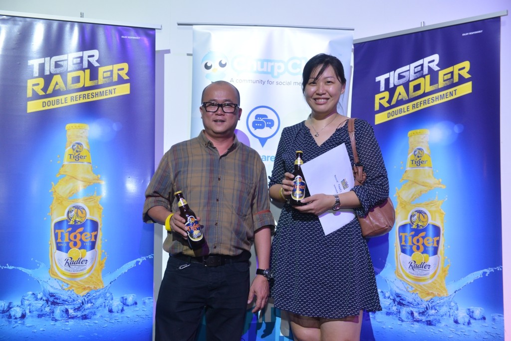 Marketing Manager of Tiger Beer, Mr Tai See Wai with winner of RM5,000 house party package, Miss Yeow Yin Yin during Tiger Radler’s Chinese New Year Open House at Souled Out, Sri Hartamas