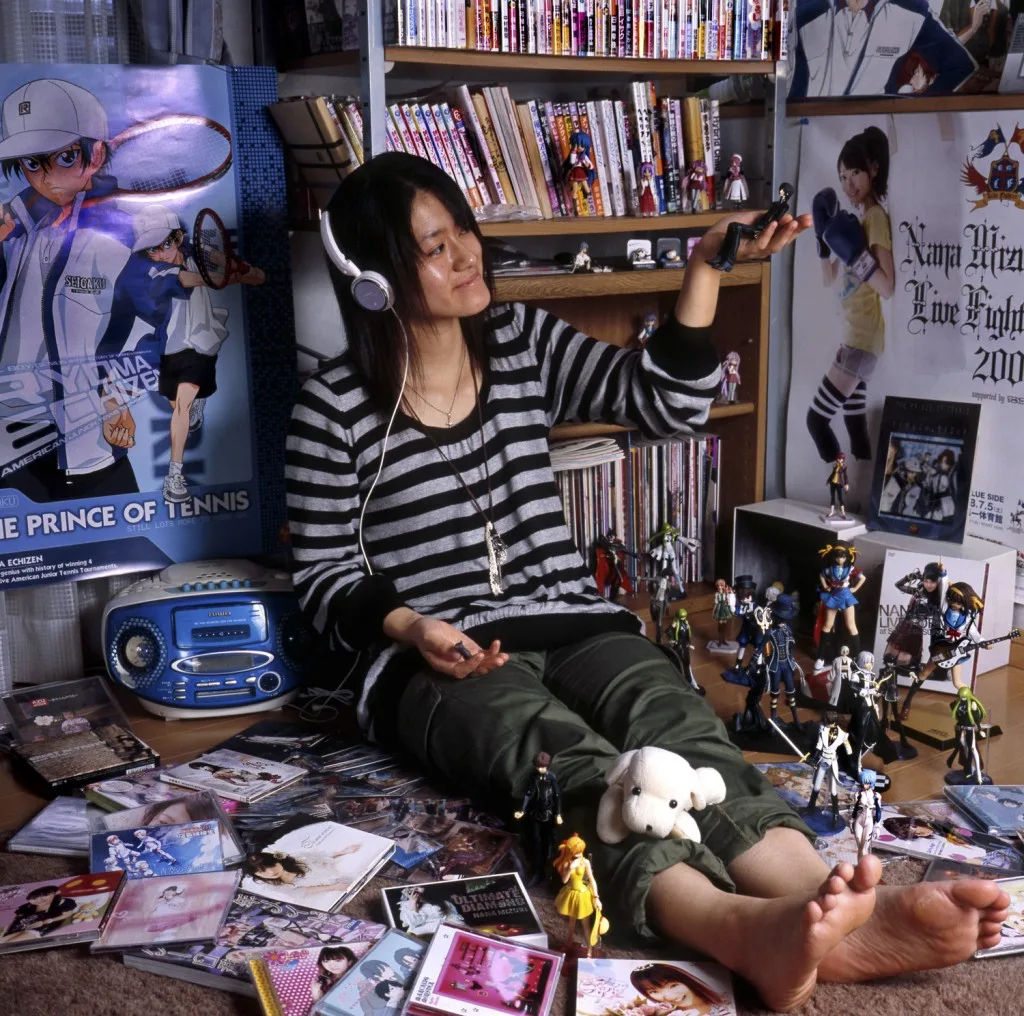 Harada Mariru, on the cover of the book "Otaku Spaces," is a "manga sommelier" who won more than 13,000 manga, 1000 limited-edition anime DVDs & 7000 video games. (Source: www.cbsdtoolkit.com)