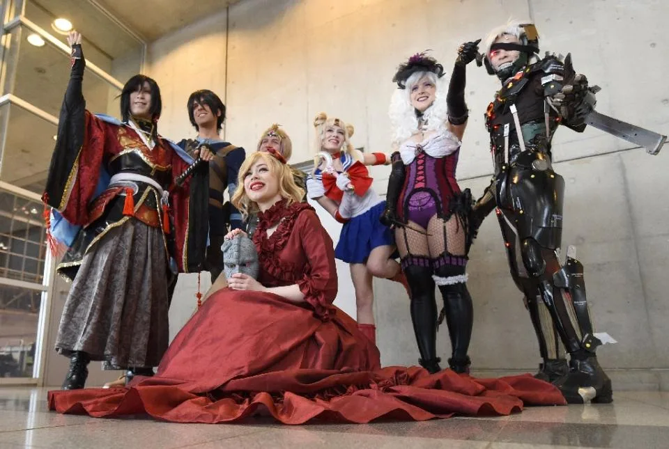 People dressed as their favourite anime characters pose for photographers during the Otaku Summit in Chiba, suburb of Tokyo, on March 28, 2015 (AFP Photo/Toru Yamanaka)