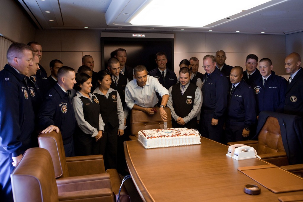 President Barack Obama celebrates the 20th anniversary of Air Force One with members of the crew (Source: Washington Post)