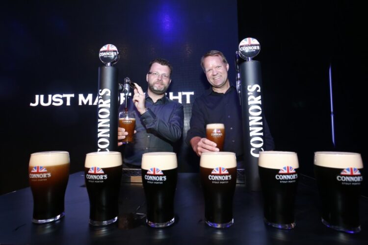 Master Brewer Kristian Dahl and Managing Director of Carlsberg Malaysia, Henrik Juel Andersen tap a pint of Connor’s Stout Porter -- a brew “Just Made Right” for modern taste buds