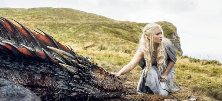 In this image released by HBO, Emilia Clarke appears in a scene from "Game of Thrones. Clarke was nominated for an Emmy Award on Thursday, July 16, 2015, for outstanding supporting actress in a drama series for her role on the show. The 67th Annual Primetime Emmy Awards will take place on Sept. 20, 2015. (HBO via AP)
