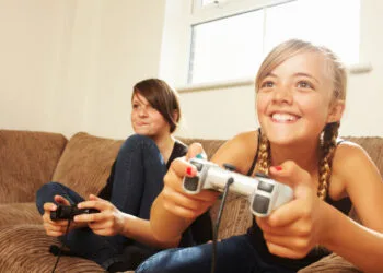 Two girls playing video game