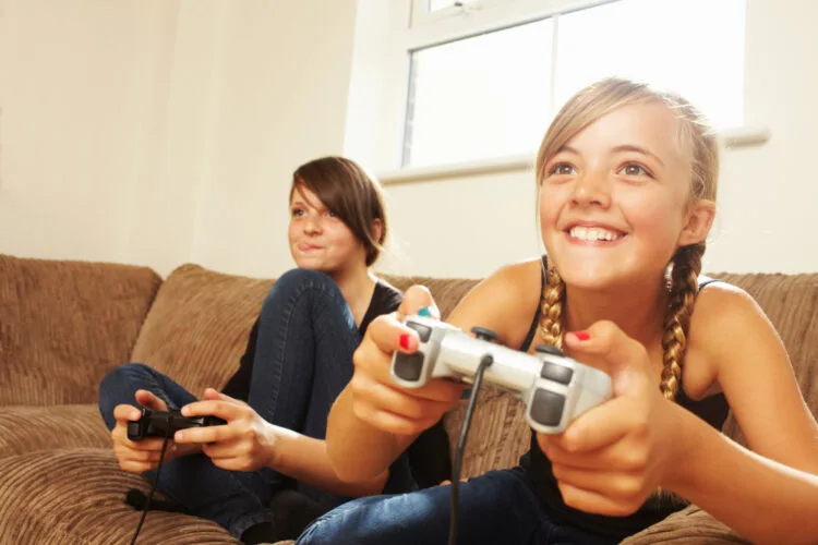 Two girls playing video game