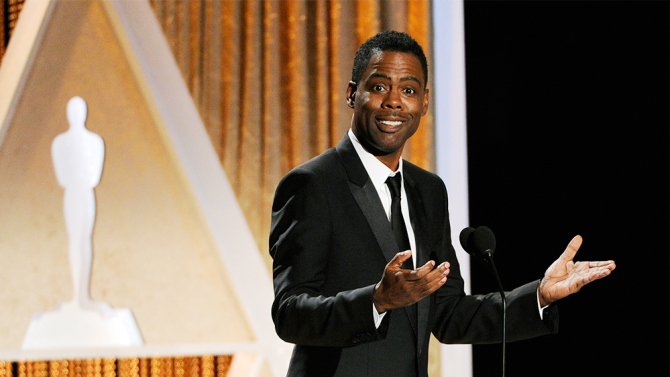 Actor/comedian Chris Rock addresses the audience during the 2014 Governors Awards on Saturday, Nov. 8, 2014, in Los Angeles. (Photo by Chris Pizzello/Invision/AP)