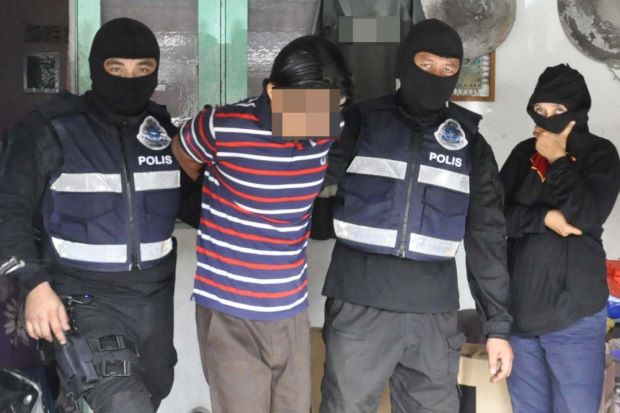 One of the seven suspected IS militants detained by police. (Source: The Star Online)