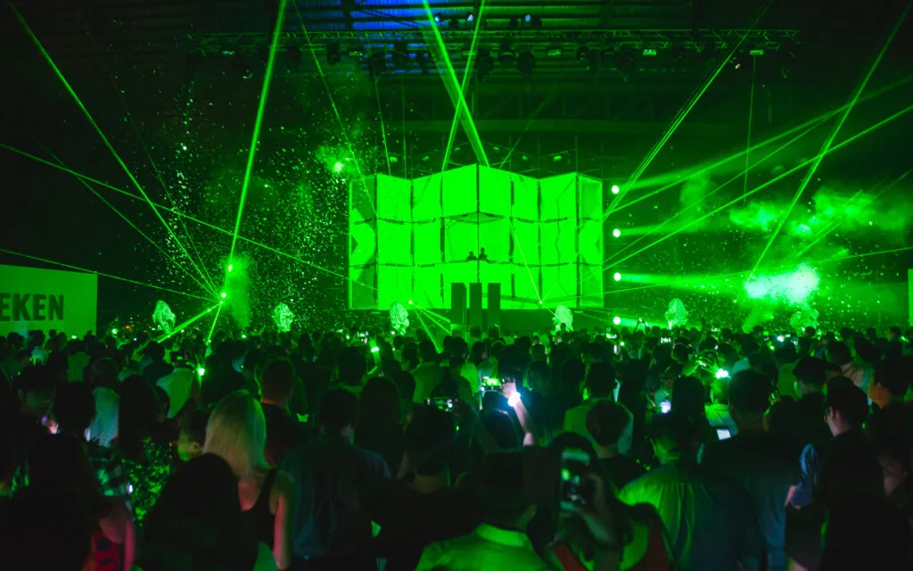 HMB Launch - The crowd is wowed by the Heineken Moment, a unique sensory experience combining mapped projections, lasers, pyros and dancers, as their wristbands flare into colourful life - Photo by © All Is Amazing _