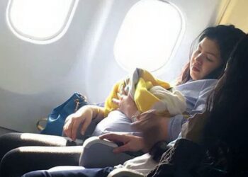 This is the amazing moment a woman gives birth prematurely at 30,000ft on a flight from Dubai to the Philippines. See SWNS story SWBIRTH. The seven-months pregnant Filipino woman, who has not been identified, went into labour unexpectedly a few hours after take-off on Sunday morning. Flustered flight attendants moved her to the front of the plane where there was more leg room - and two off-duty nurses on the flight came to help. Amazingly, the healthy baby girl - named Haven - was delivered safely in just one hour - amid cheers from fellow passengers on the nine-hour flight to Manila. A male air steward even a suggested the lucky girl could get free flights for life on the budget carrier - an unwritten tradition among some airlines when a baby is born on a plane. Missy Berberabe Umandal(corr), 20, who took pictures of the mother and baby on the Cebu Pacific Air flight said it was 'the most amazing thing she's seen on a flight'.