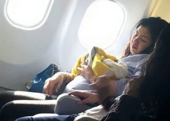 This is the amazing moment a woman gives birth prematurely at 30,000ft on a flight from Dubai to the Philippines. See SWNS story SWBIRTH. The seven-months pregnant Filipino woman, who has not been identified, went into labour unexpectedly a few hours after take-off on Sunday morning. Flustered flight attendants moved her to the front of the plane where there was more leg room - and two off-duty nurses on the flight came to help. Amazingly, the healthy baby girl - named Haven - was delivered safely in just one hour - amid cheers from fellow passengers on the nine-hour flight to Manila. A male air steward even a suggested the lucky girl could get free flights for life on the budget carrier - an unwritten tradition among some airlines when a baby is born on a plane. Missy Berberabe Umandal(corr), 20, who took pictures of the mother and baby on the Cebu Pacific Air flight said it was 'the most amazing thing she's seen on a flight'.