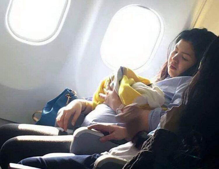 This is the amazing moment a woman gives birth prematurely at 30,000ft on a flight from Dubai to the Philippines. See SWNS story SWBIRTH. The seven-months pregnant Filipino woman, who has not been identified, went into labour unexpectedly a few hours after take-off on Sunday morning. Flustered flight attendants moved her to the front of the plane where there was more leg room - and two off-duty nurses on the flight came to help. Amazingly, the healthy baby girl - named Haven - was delivered safely in just one hour - amid cheers from fellow passengers on the nine-hour flight to Manila. A male air steward even a suggested the lucky girl could get free flights for life on the budget carrier - an unwritten tradition among some airlines when a baby is born on a plane. Missy Berberabe Umandal(corr), 20, who took pictures of the mother and baby on the Cebu Pacific Air flight said it was 'the most amazing thing she's seen on a flight'.