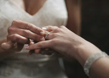 Cropped shot of two unrecognisable women exchanging rings on their wedding day