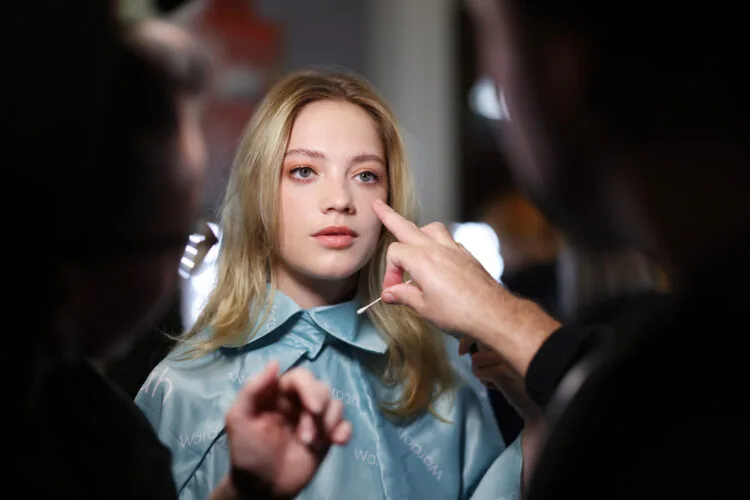 LONDON, ENGLAND - SEPTEMBER 20: A model is prepared backstage ahead of the Klamby SS23 runway show presented by Wardah, during London Fashion Week on September 20, 2022 in London, England. (Photo by Tim P. Whitby/Getty Images for Klamby)