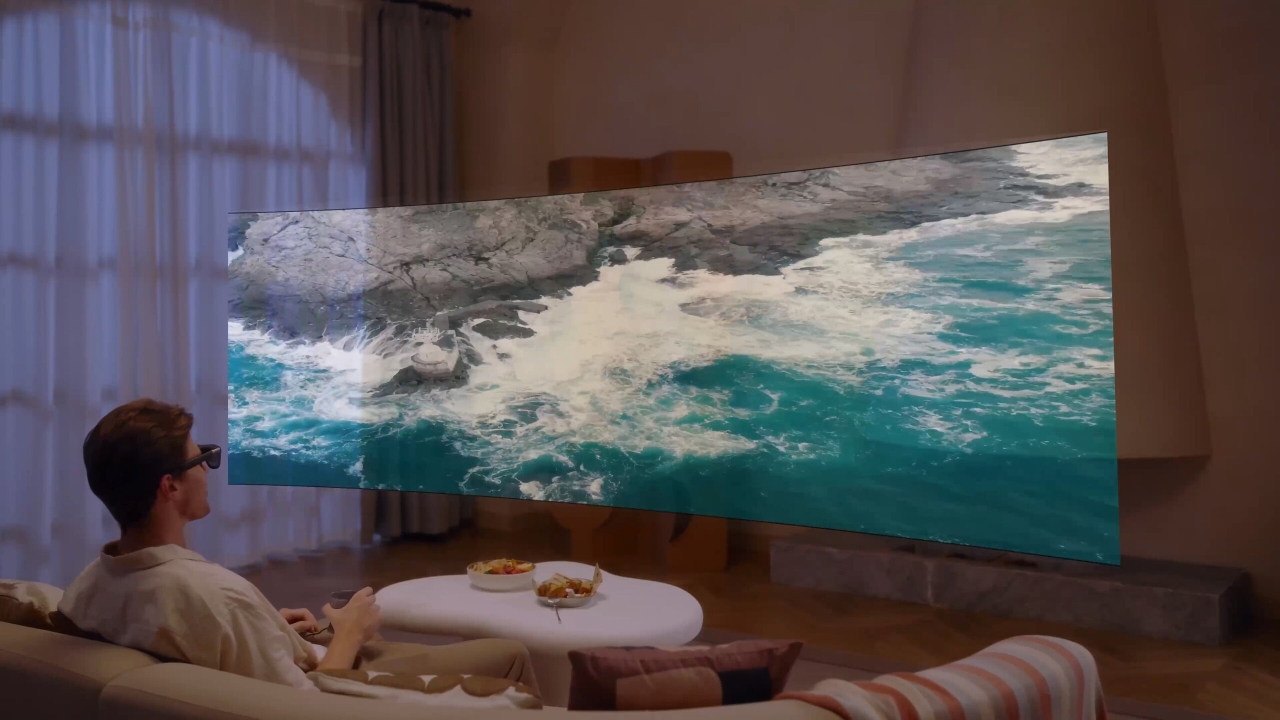 Xreal One Pro showing ultrawide screen capability, AR display in a living room
