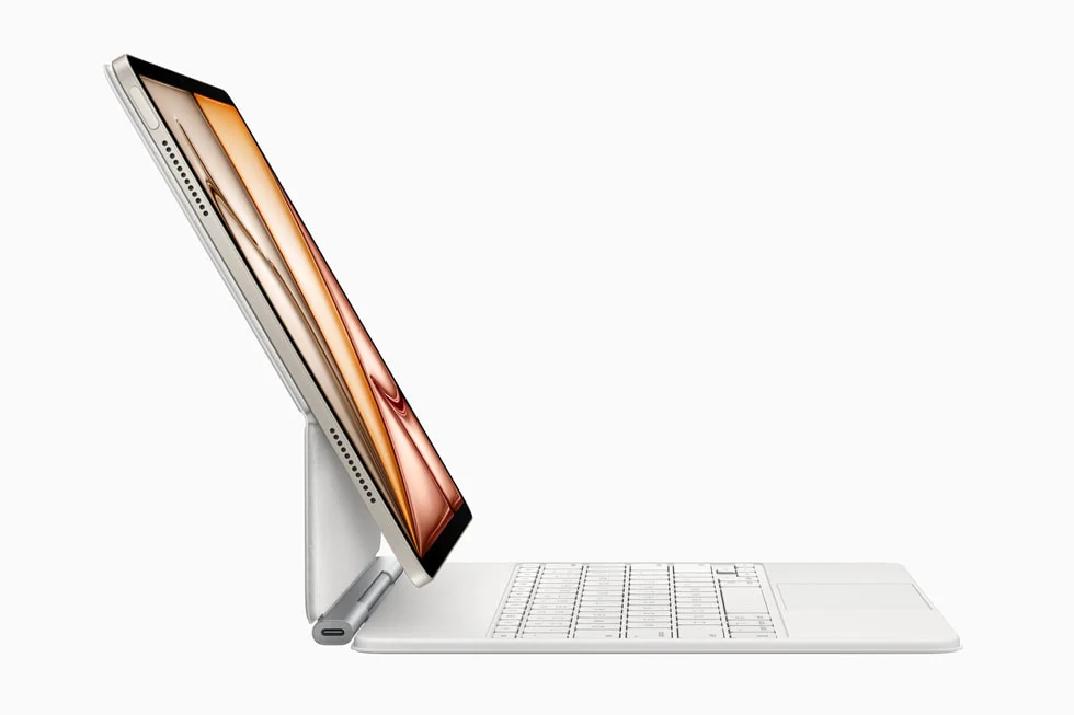 The new iPad Air is shown from the side with the new Magic Keyboard.