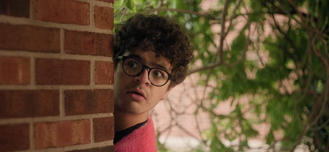 Gaten Matarazzo runs from his campus kids in "Pizza Movie"