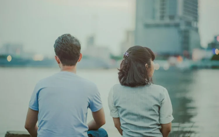 Photo by Min An: https://www.pexels.com/photo/selective-focus-photography-of-man-and-woman-watching-body-of-water-and-concrete-buildings-1004012/