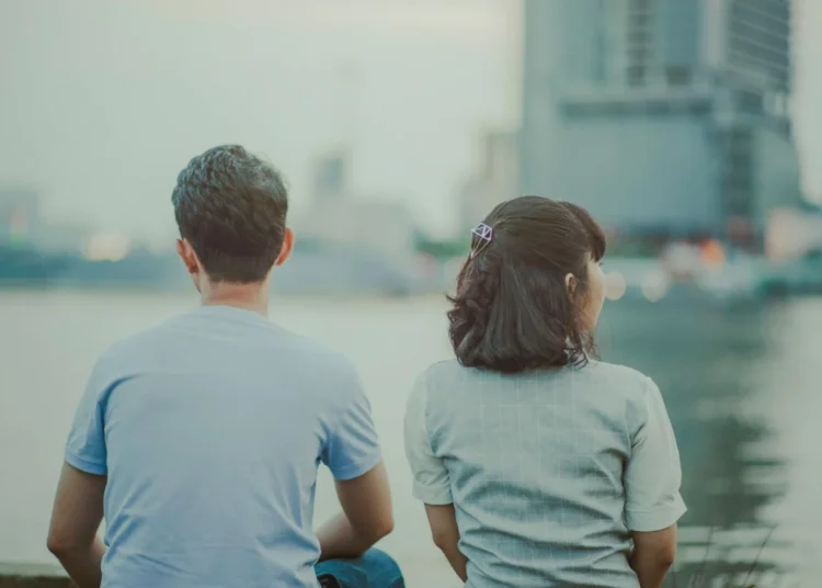 Photo by Min An: https://www.pexels.com/photo/selective-focus-photography-of-man-and-woman-watching-body-of-water-and-concrete-buildings-1004012/