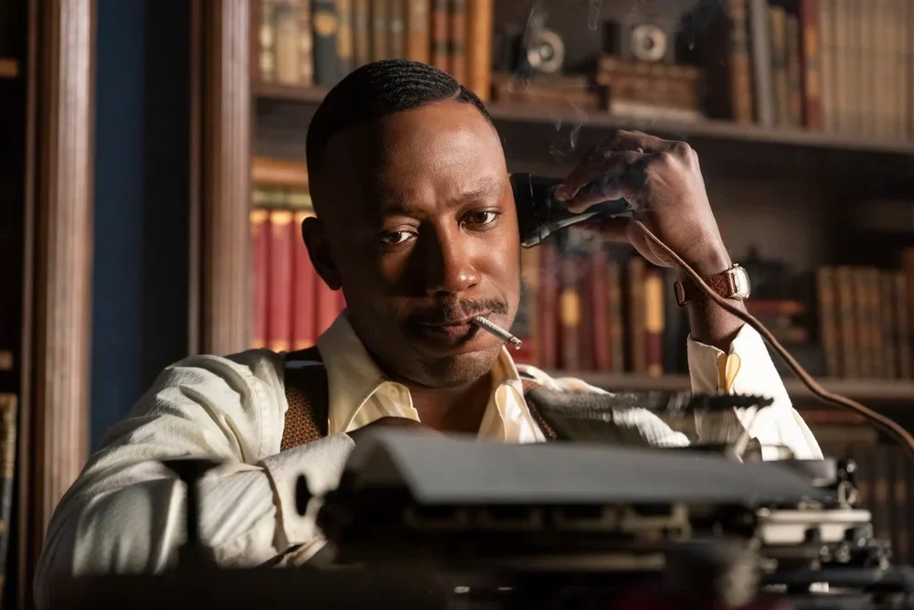 Lamorne Morris as Robbie Robertson in "Spider Noir"